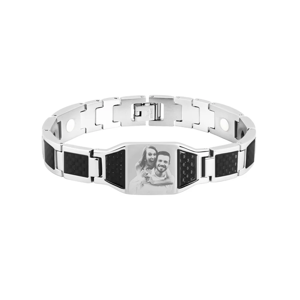 Silver-colored link bracelet with a grayscale portrait of two people on its central panel