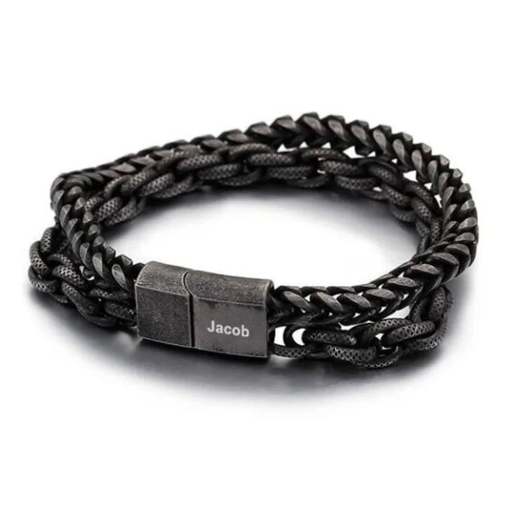 Dark bracelet combining chain links and a cord with Jacob shown on the clasp